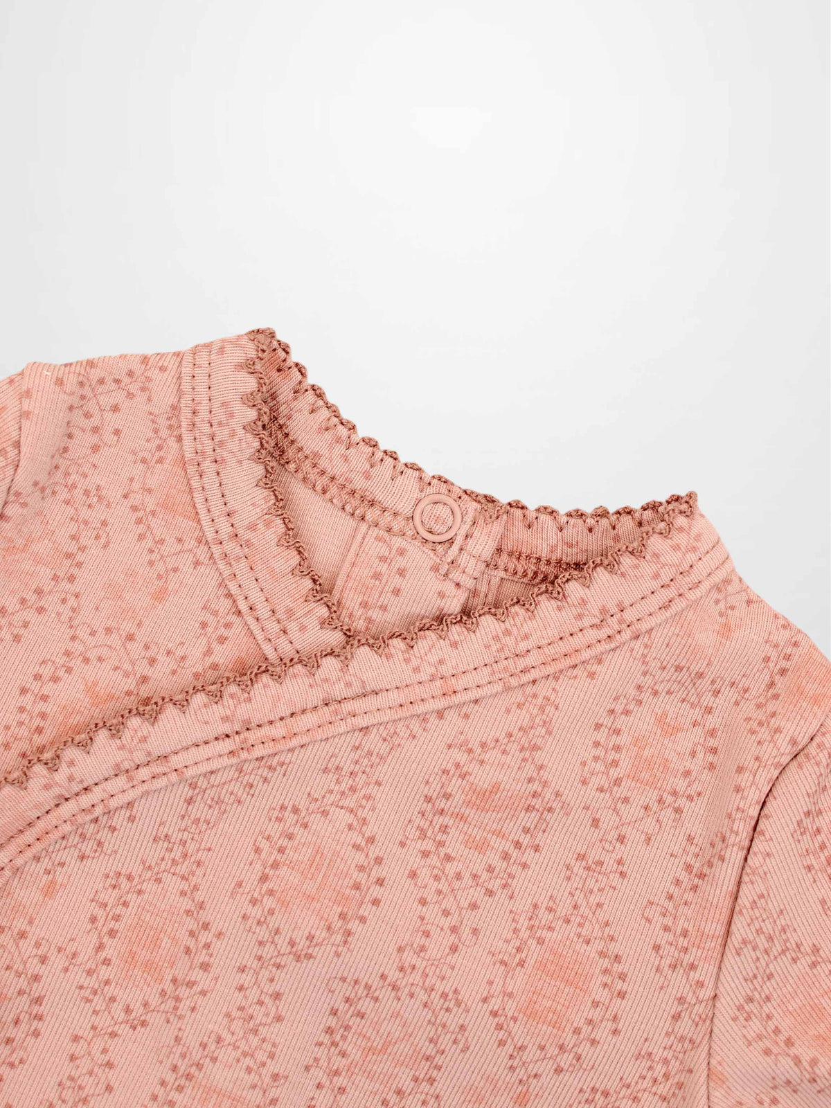 Pink Charm Stretchy girls top with vine pattern and scalloped neckline.