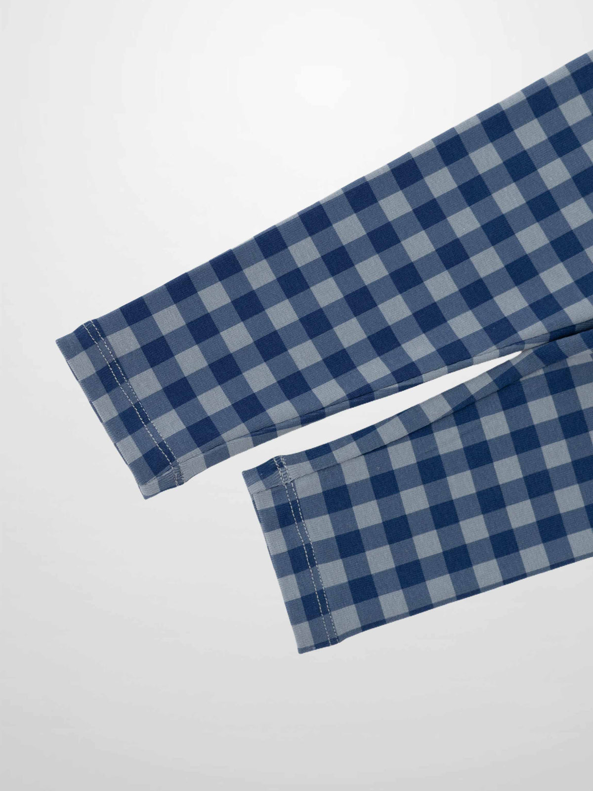 Blue gingham pajama sleeves in a blue checkered pattern.