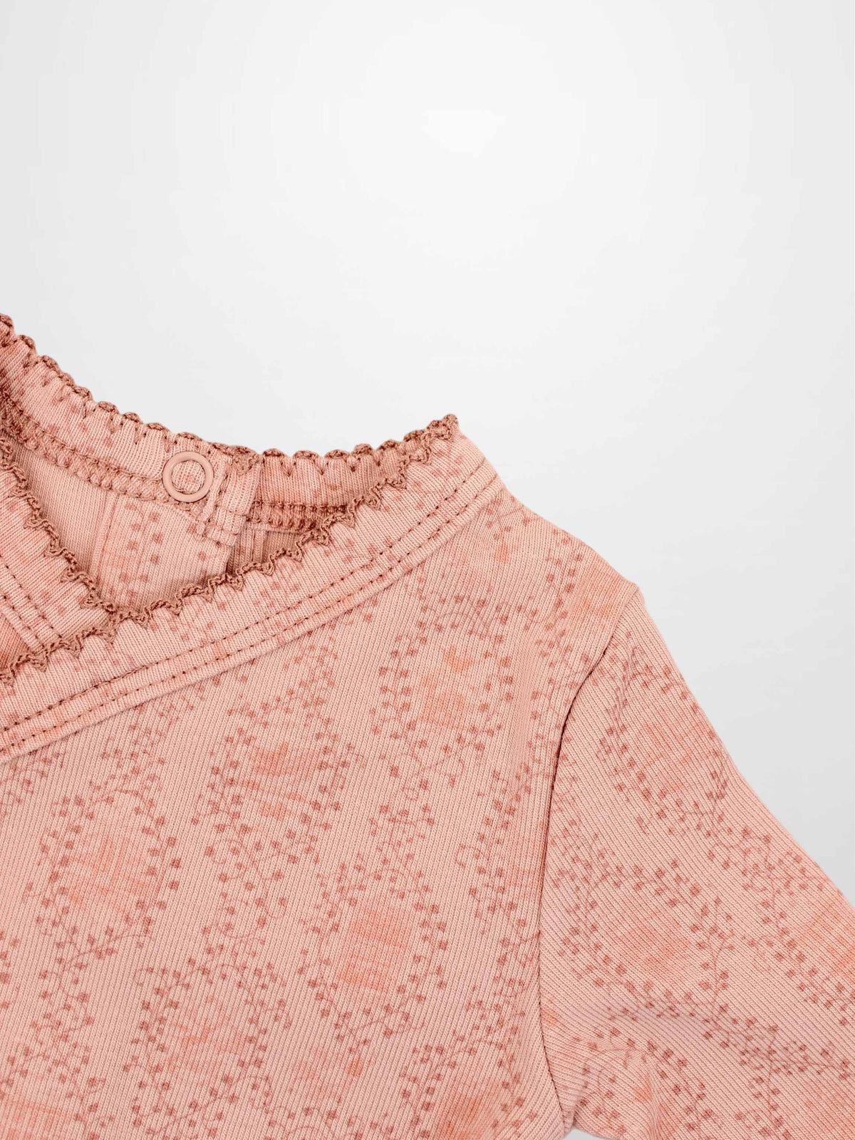 Pink Adee Girls Stretchies top with vine-knit pattern and scalloped neckline.