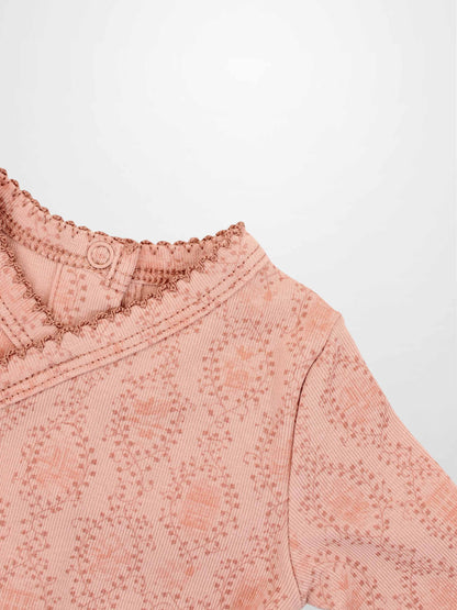 Pink Adee Girls Stretchies top with vine-knit pattern and scalloped neckline.