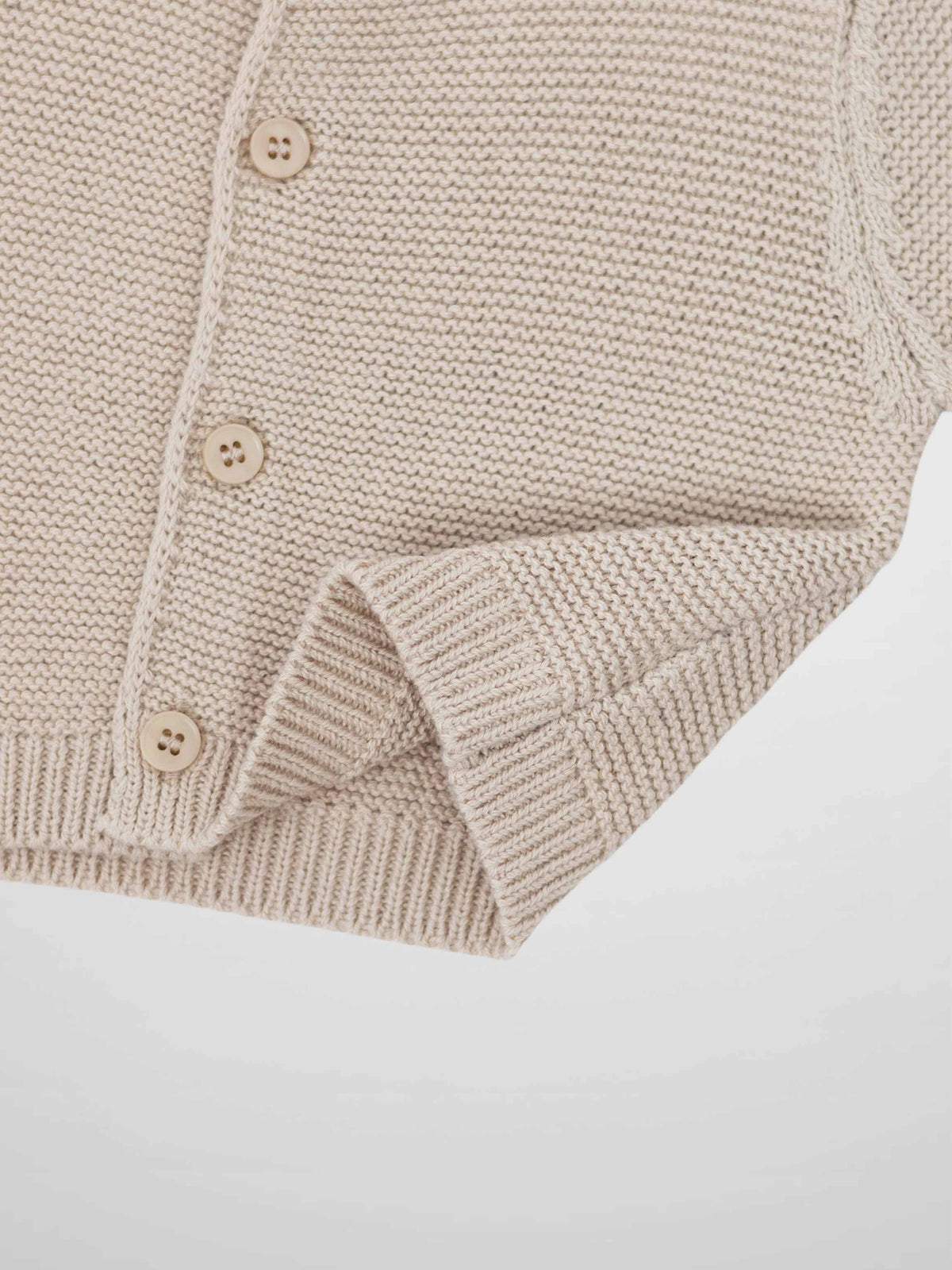 Knit cardigan tan by Adee; unisex dressy top with button front.