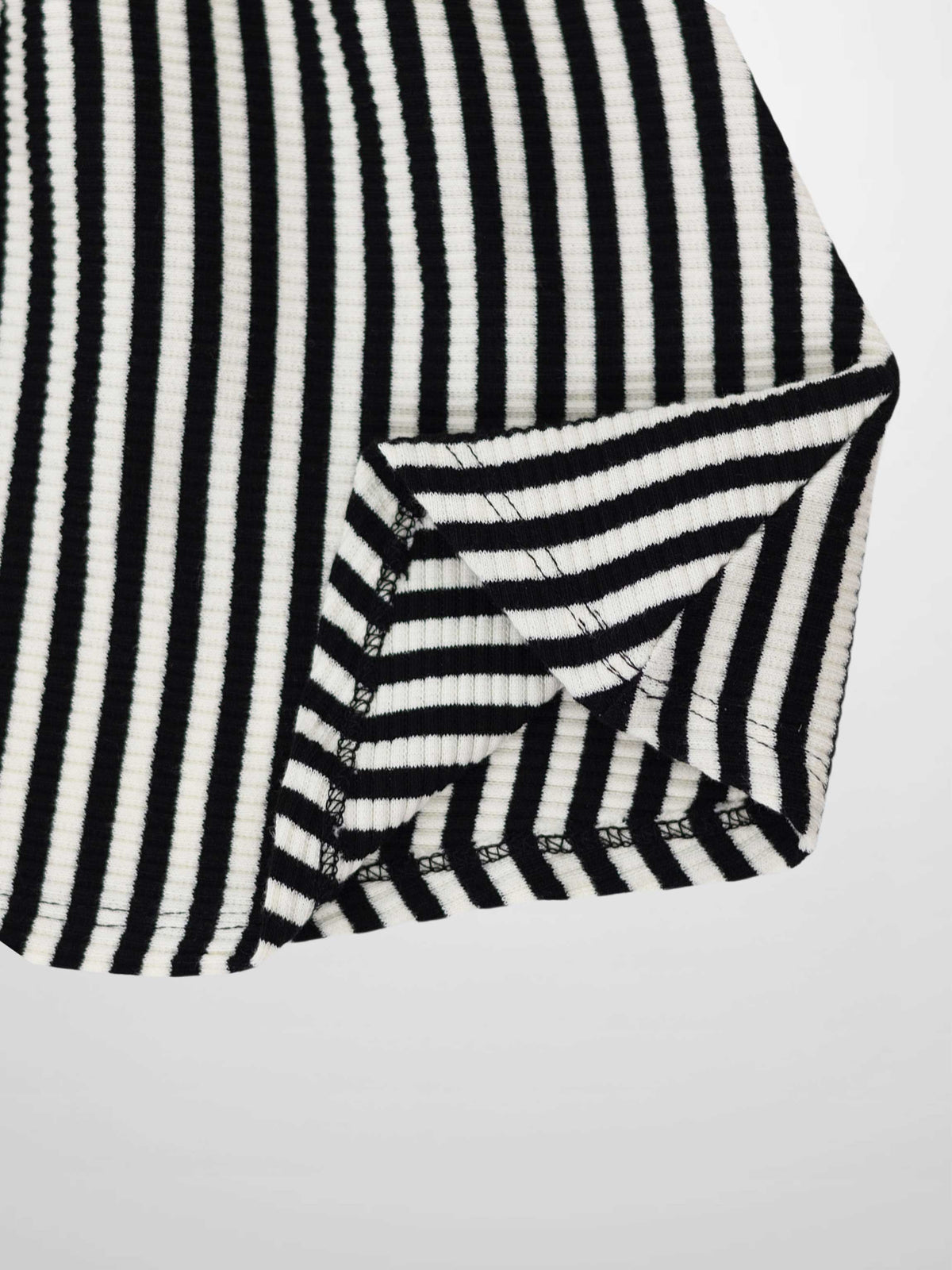 Striped black-and-white ribbed circle skirt for girls, flared silhouette with a wide black elastic waistband.