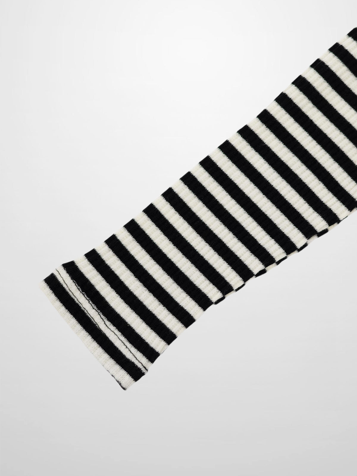 Striped crew-neck girls’ T-shirt by Adee in black and white with textured ribbed fabric.