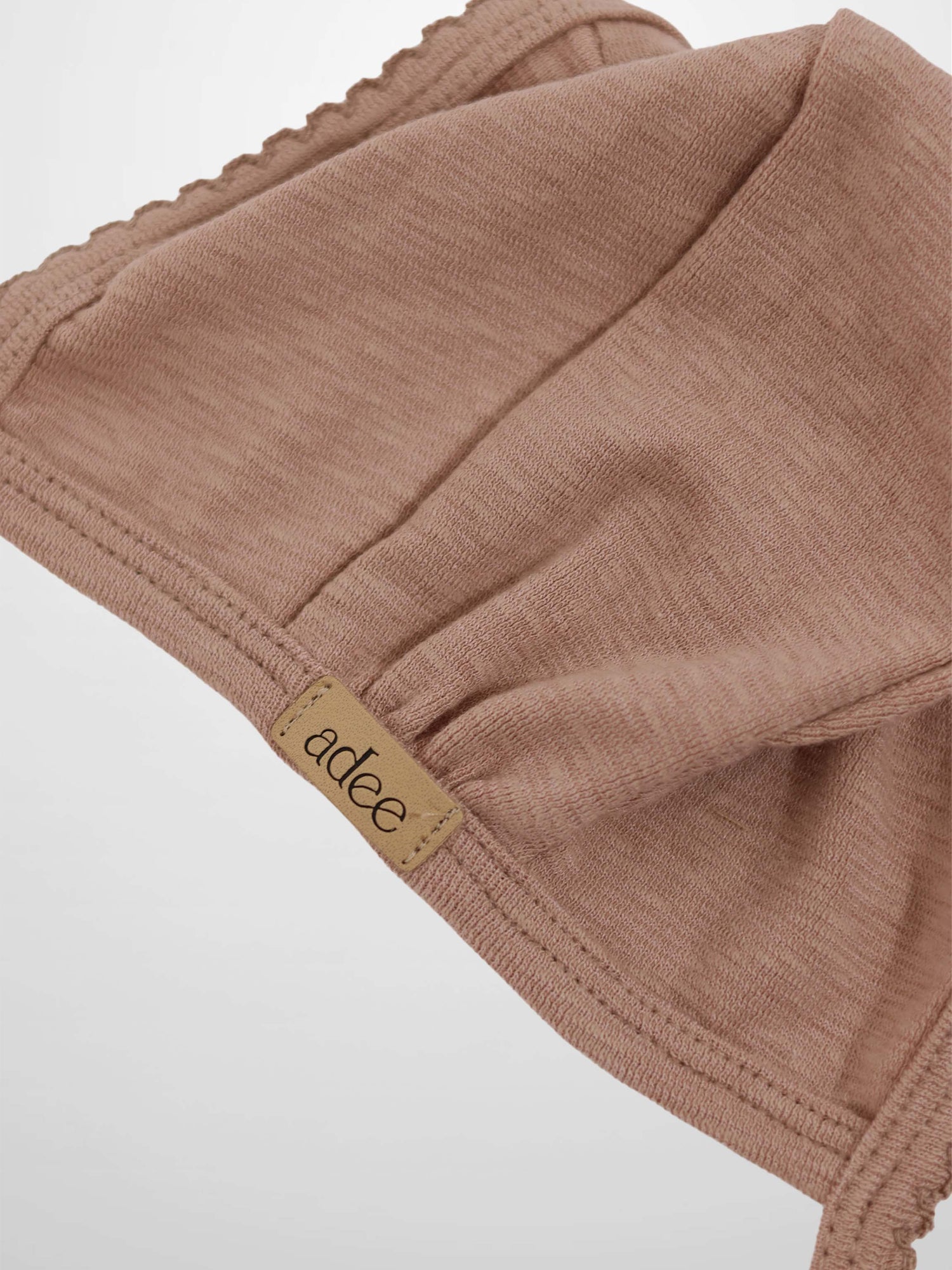 Pink scalloped bonnet for girls by Adee in dusty pink fabric