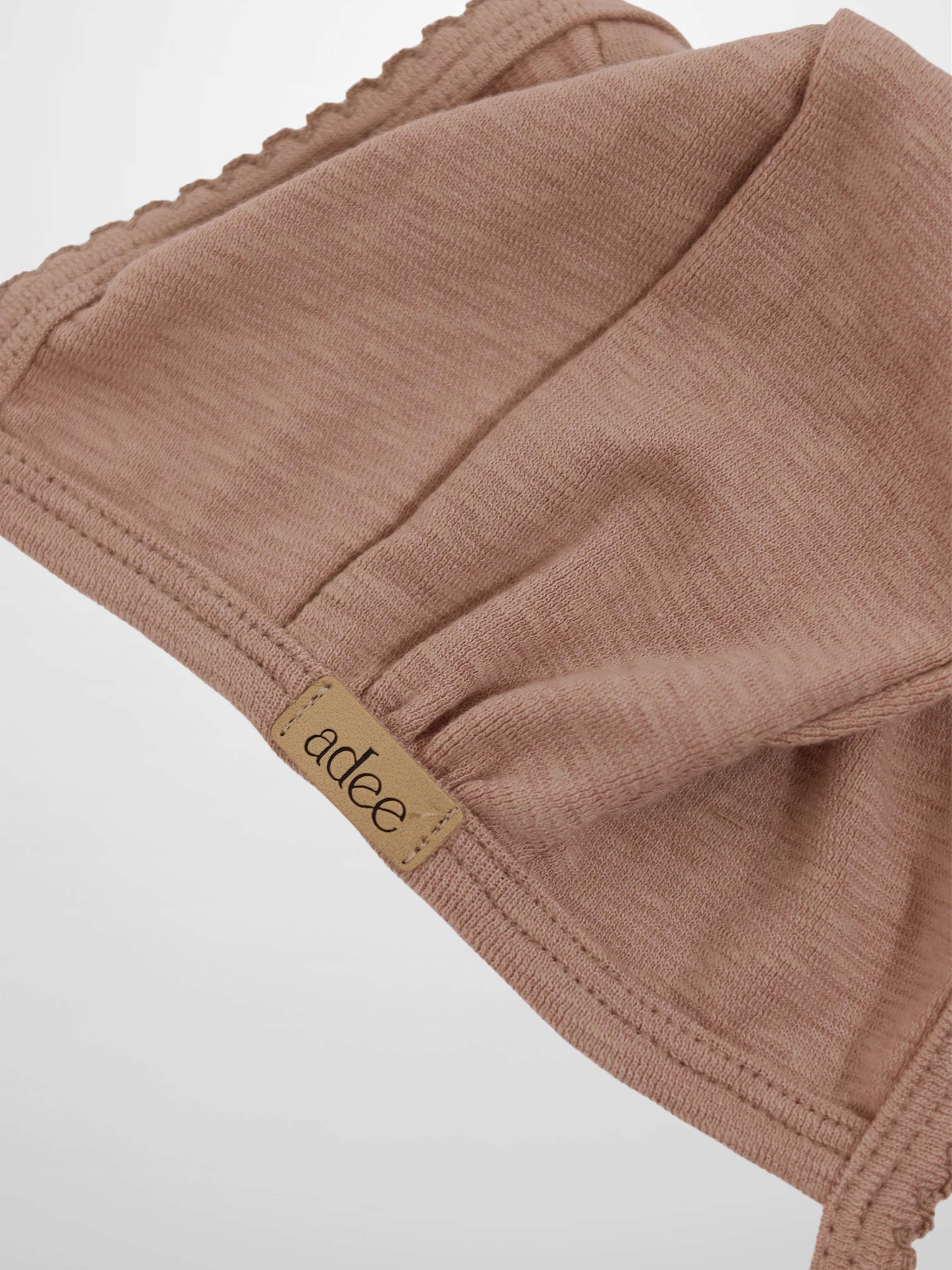 Pink scalloped bonnet for girls by Adee in dusty pink fabric