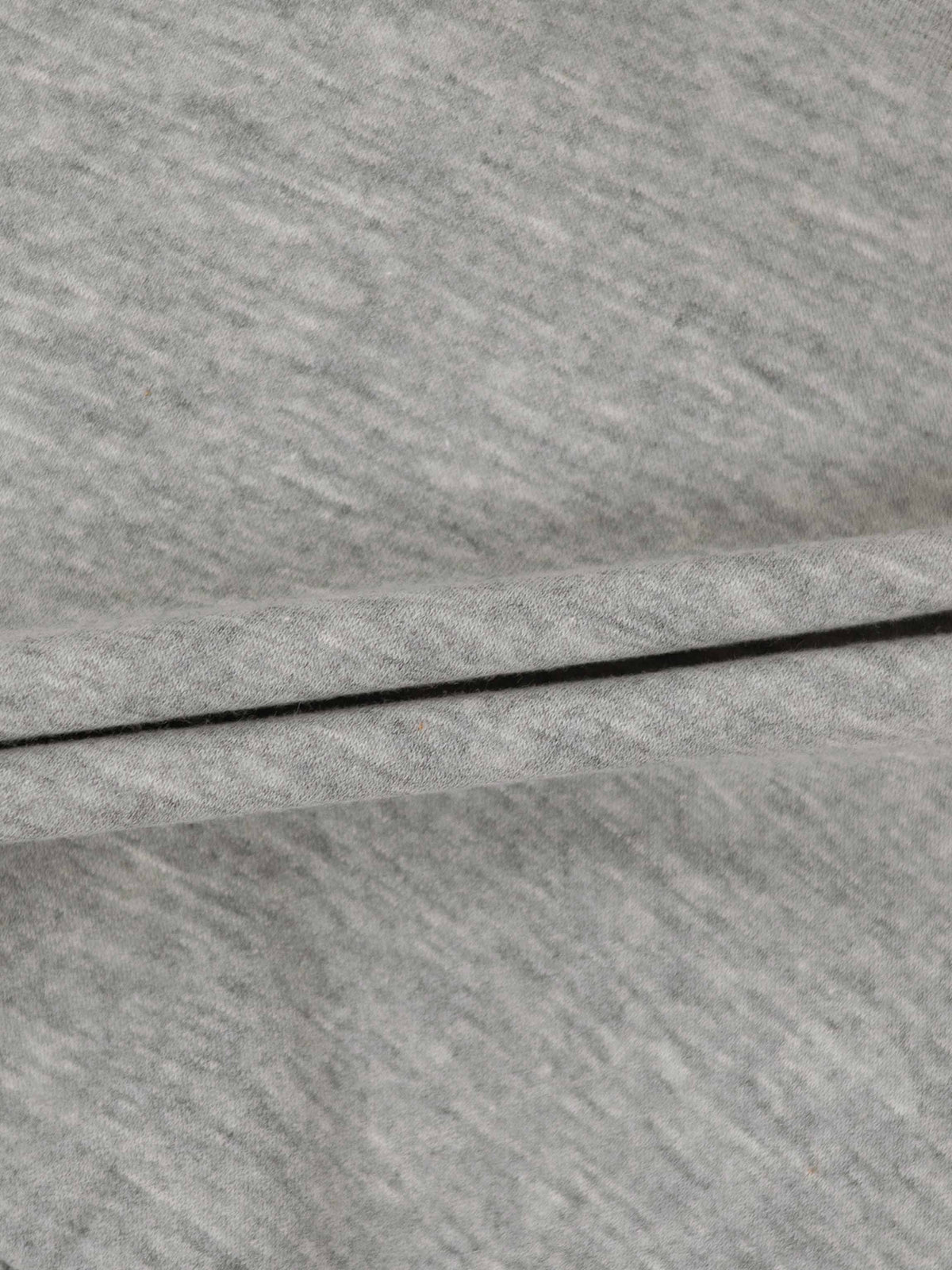 Close-up of heather gray sweatshirt fabric showing soft knit texture.