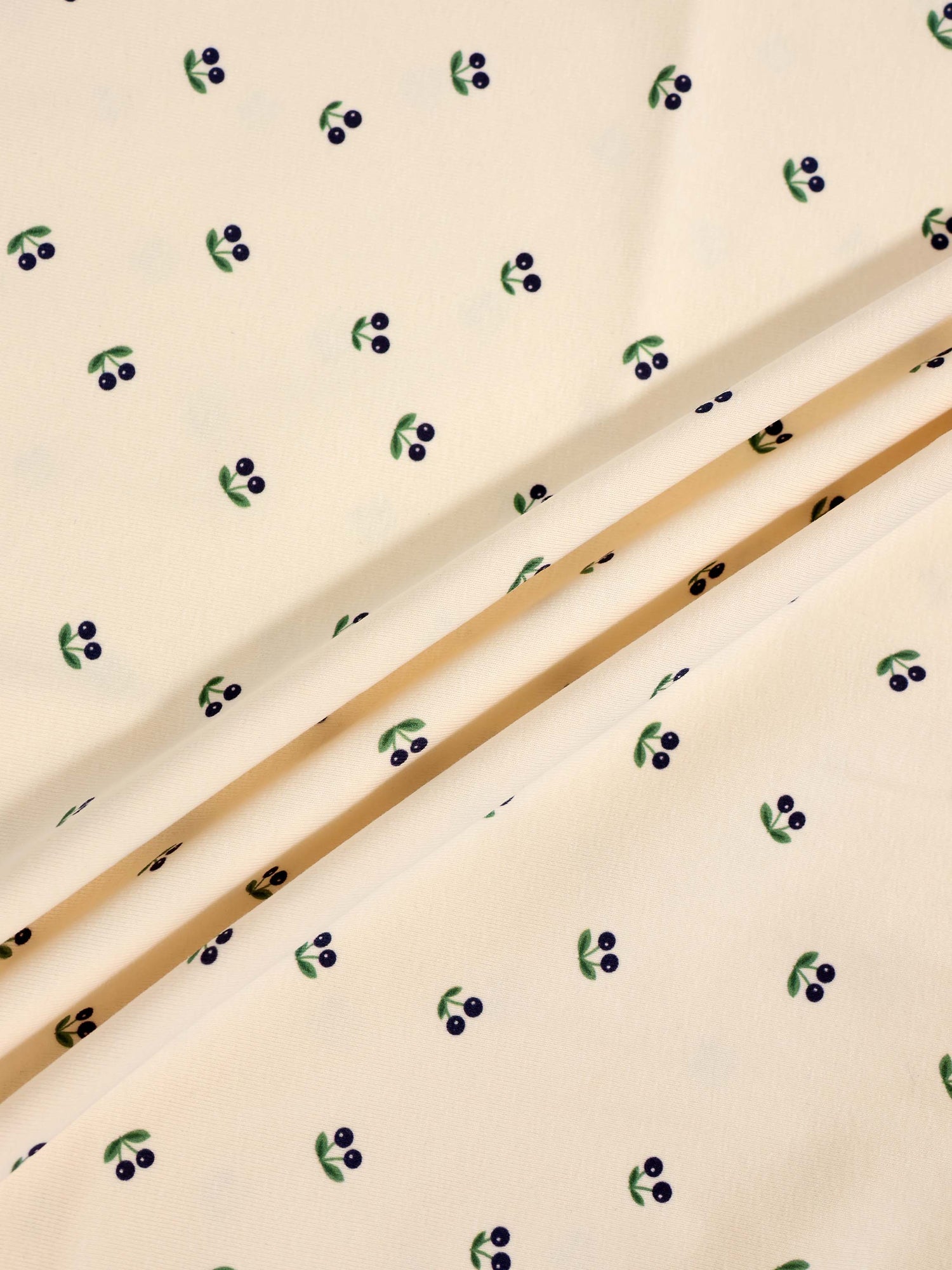 Blue Cherry Stretchy by Adee, boys stretchies fabric with blue cherries on green leaves