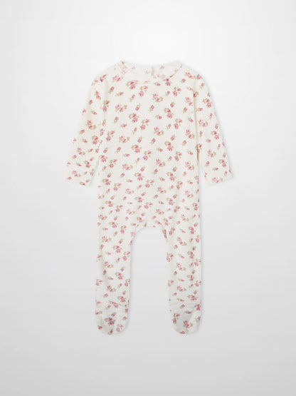 Tiny Blossom layette set sleeper, cream fabric with pink floral print, long-sleeve and footed.