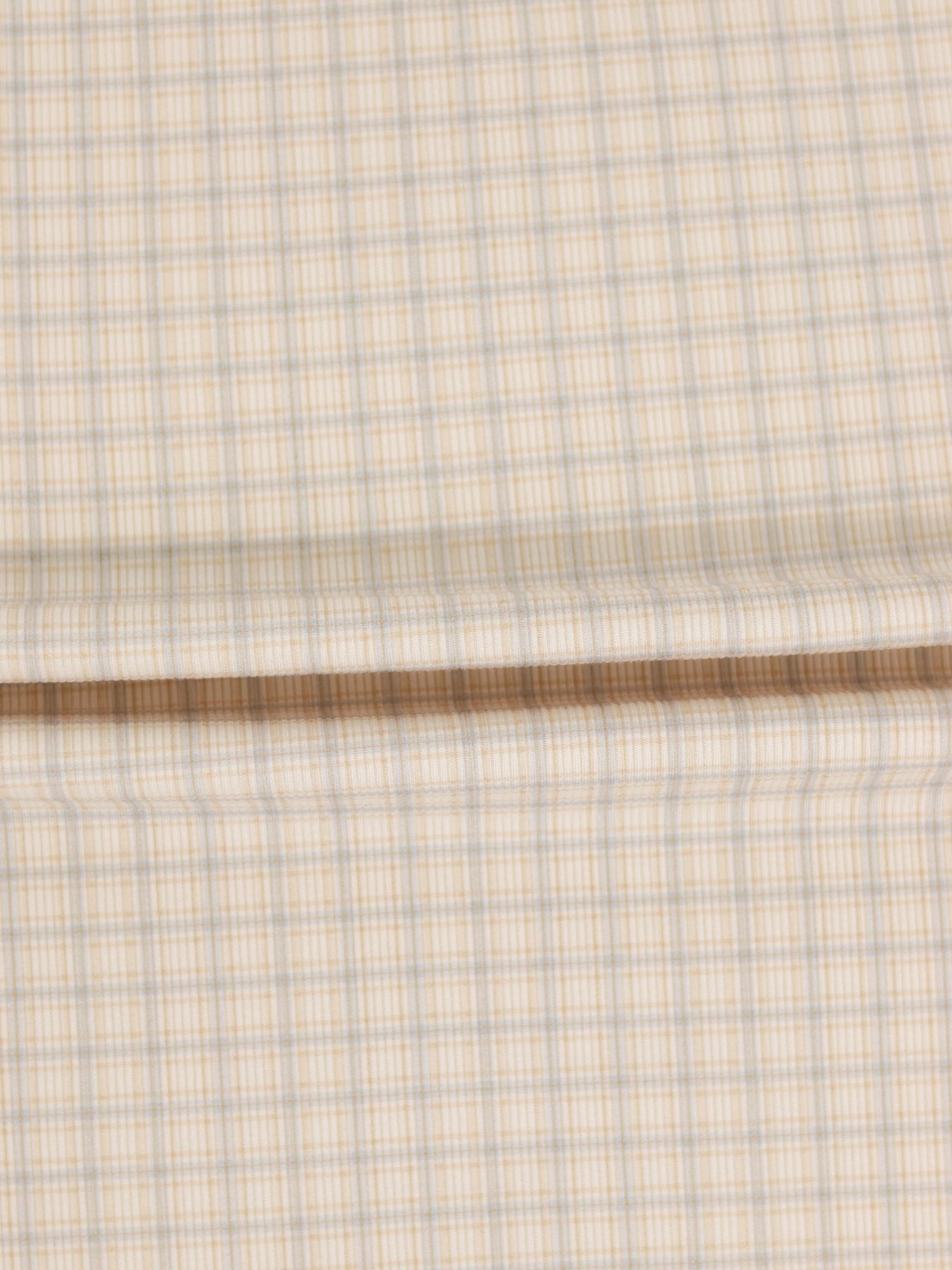 Oatmeal Grid Stretchy fabric swatch in beige with blue grid lines.
