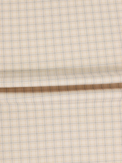 Oatmeal Grid Stretchy fabric swatch in beige with blue grid lines.