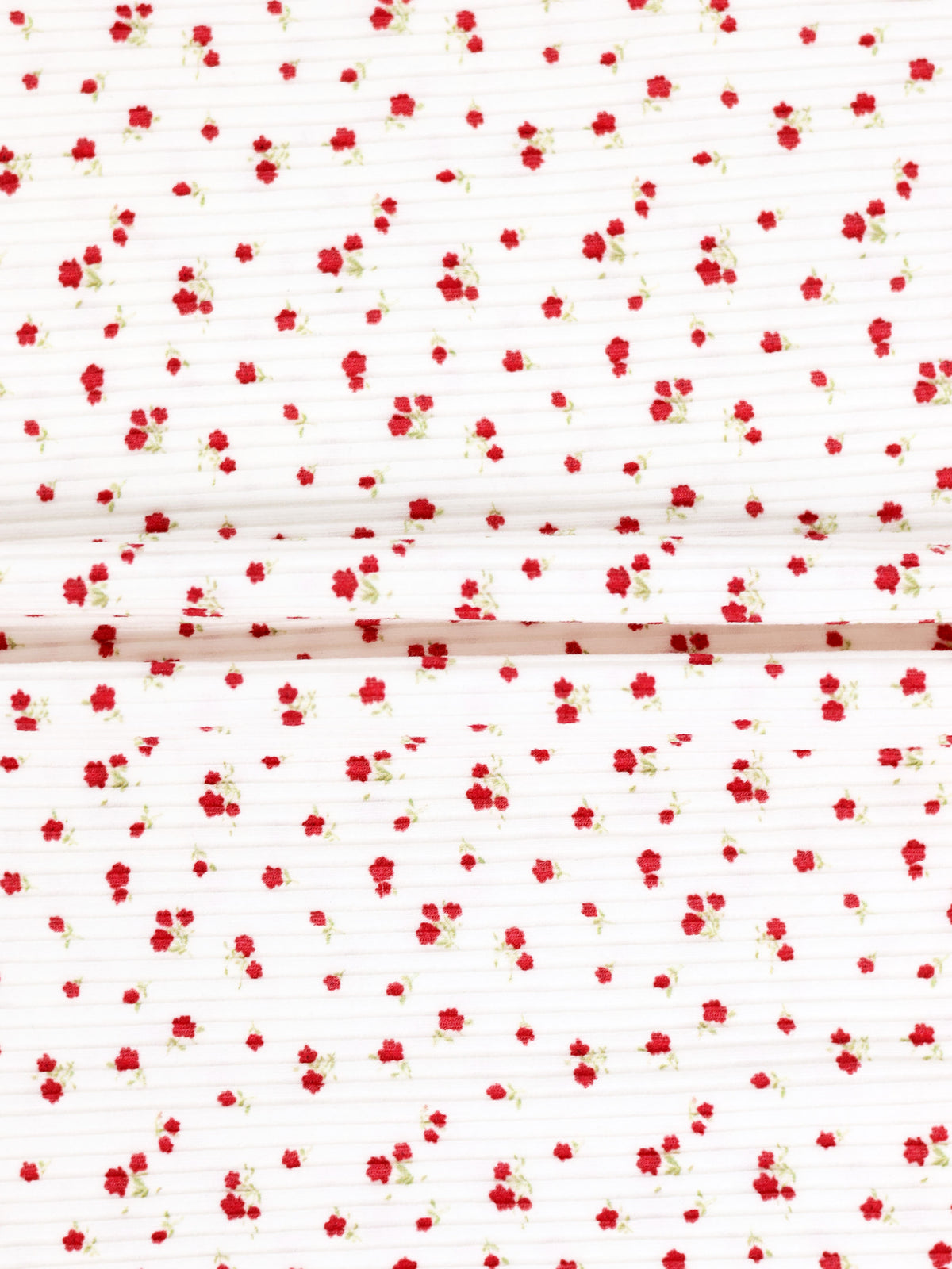 Red Flower Stretchy girls stretchies fabric with tiny red flowers on white background, two folded panels