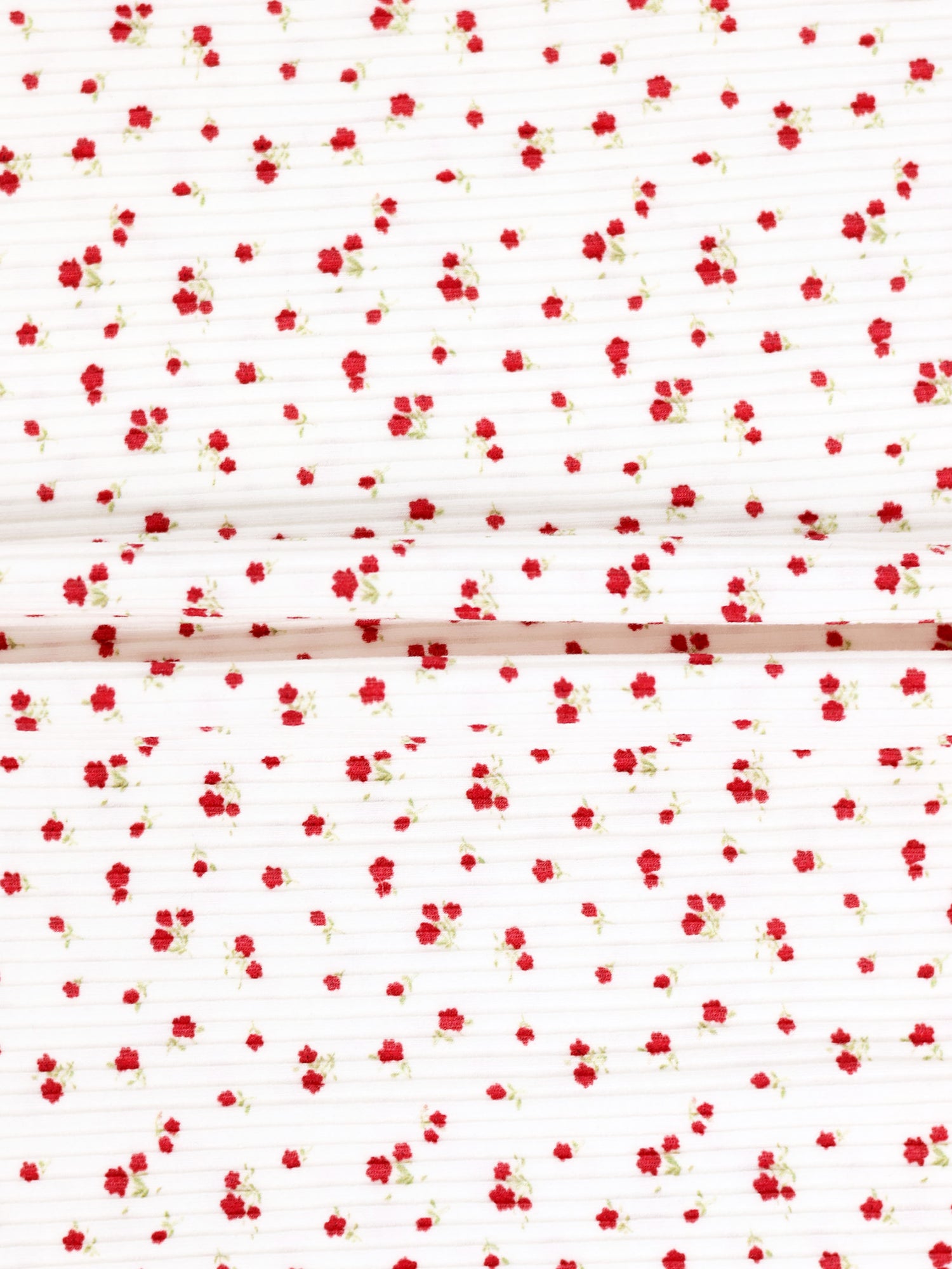 Red Flower Stretchy girls stretchies fabric with tiny red flowers on white background, two folded panels