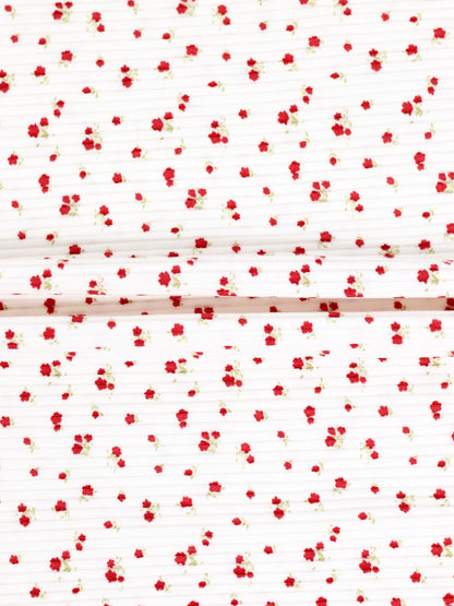 Red Flower Stretchy girls stretchies fabric with tiny red flowers on white background, two folded panels