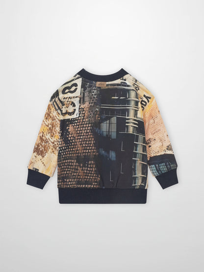 Skyscraper sweatshirt for boys by Adee with cityscape graphic and navy rib cuffs.