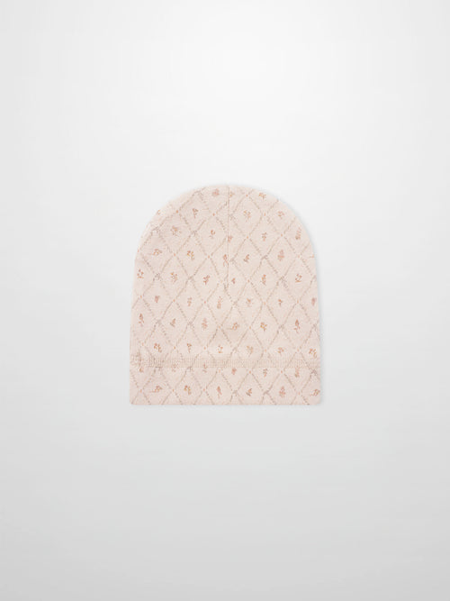 Dainty Diamond Hat by Adee for girls; pale pink knit with a diamond lattice pattern.