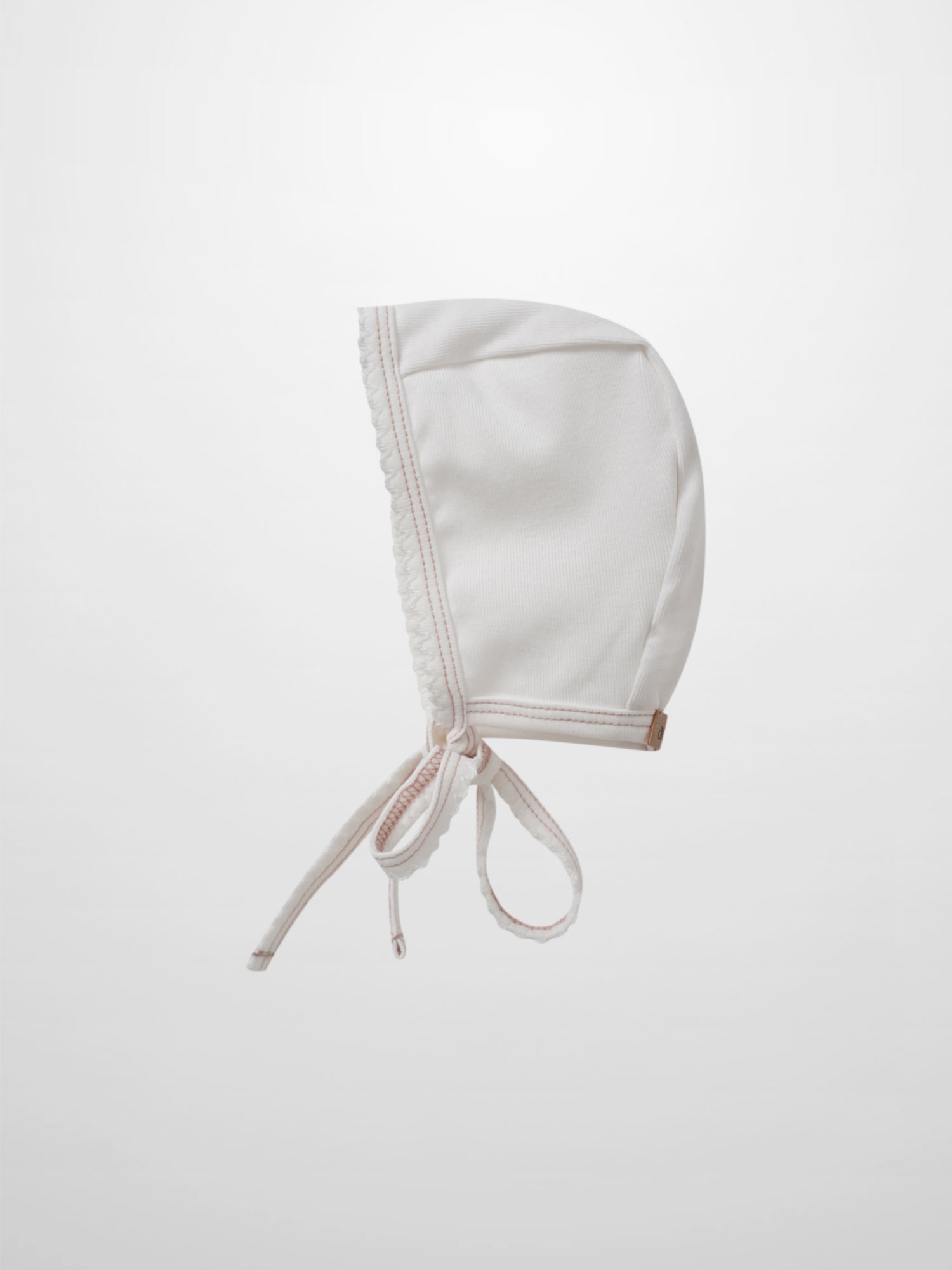 Mini Gallery Bonnet - Pink by Adee, white bonnet with pink stitching and ribbon ties