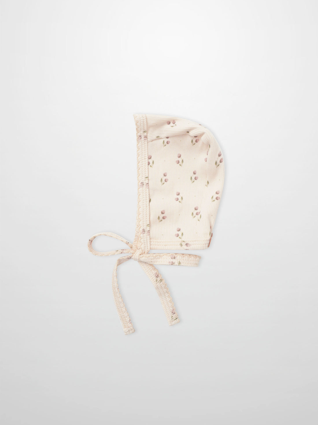 Tiny Tulip Bonnet for girls by Adee; pale pink floral print fabric with tie straps