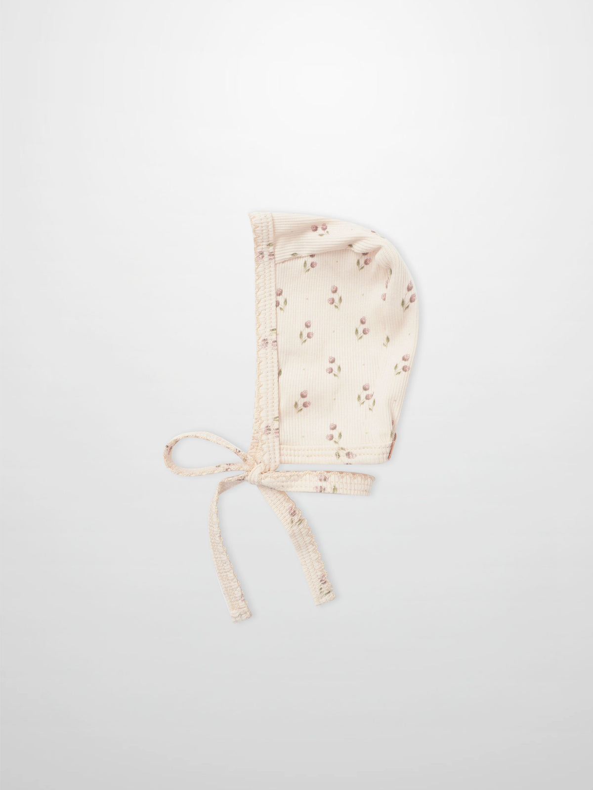 Tiny Tulip Bonnet for girls by Adee; pale pink floral print fabric with tie straps