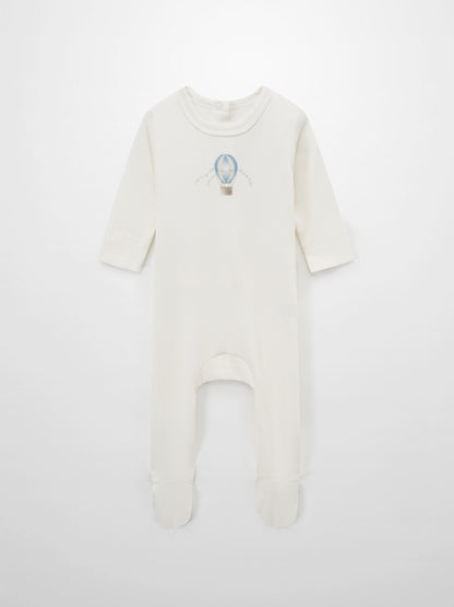 Blue Balloon Stretchy romper; cream ribbed fabric with footed long-sleeve design.