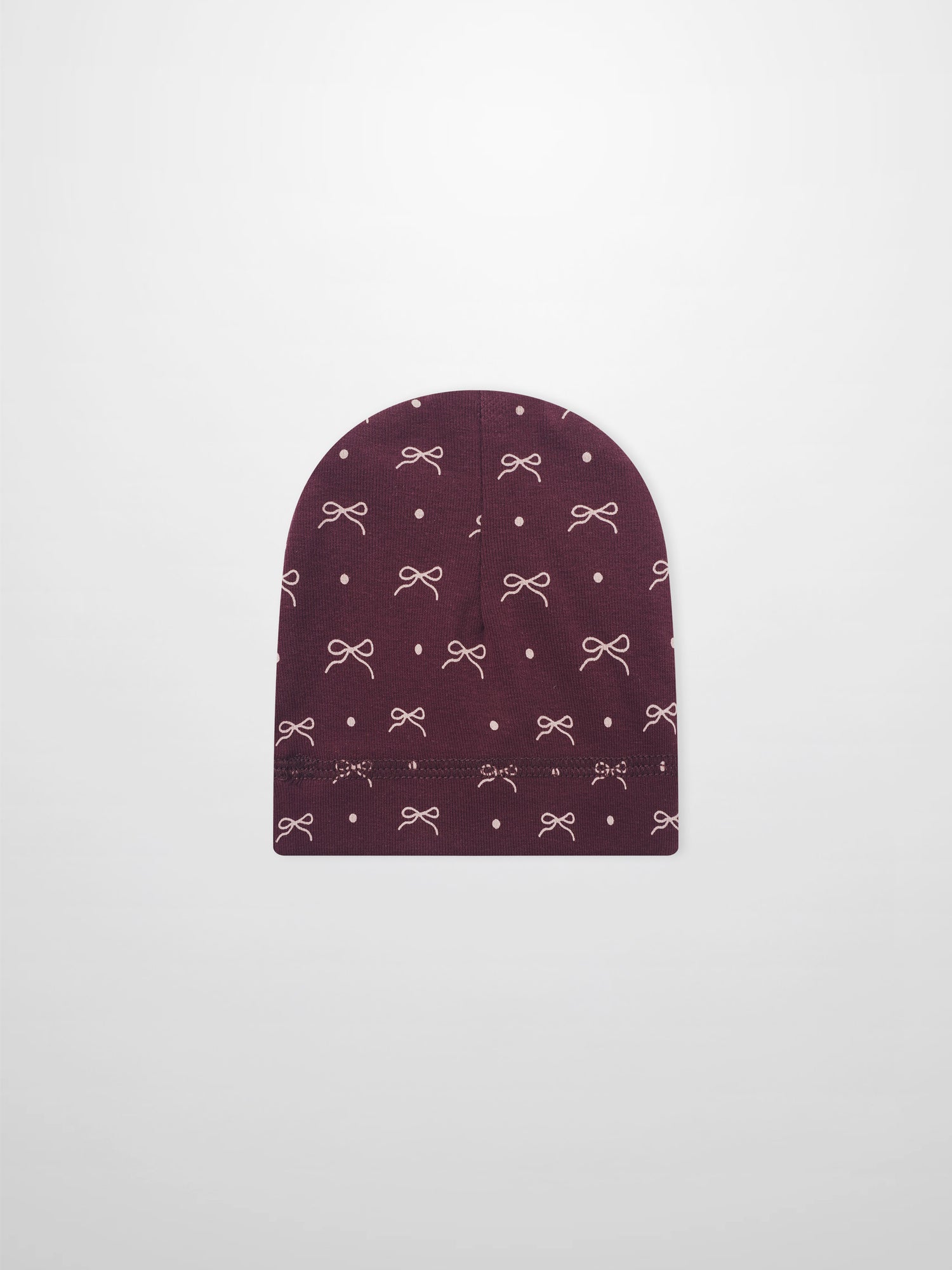 Girls burgundy bow hat with white bow and dot pattern on knit fabric