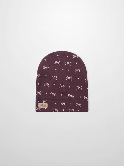 Burgundy bow hat for girls by Adee with white bow pattern