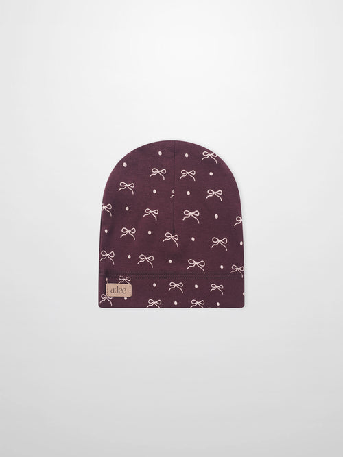 Burgundy bow hat for girls by Adee with white bow pattern