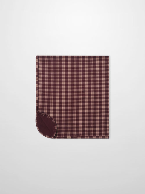 Girls swaddle blanket, burgundy plaid with scalloped trim, Adee brand.