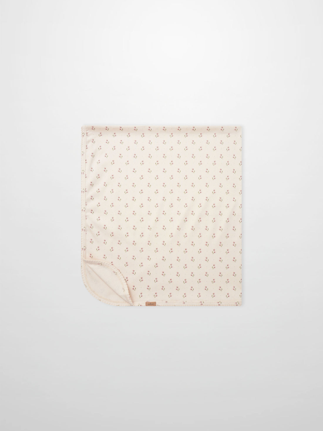 Tiny Tulip Blanket by Adee; pale pink girls swaddle blanket with a delicate tiny tulip print design.