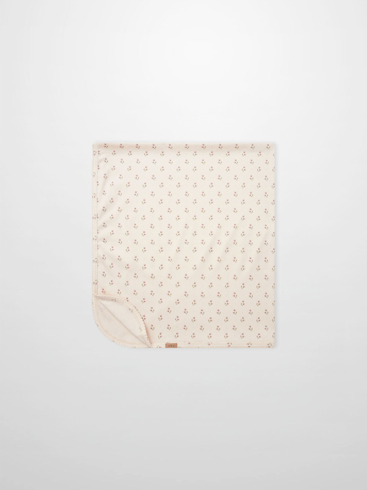 Tiny Tulip Blanket by Adee; pale pink girls swaddle blanket with a delicate tiny tulip print design.