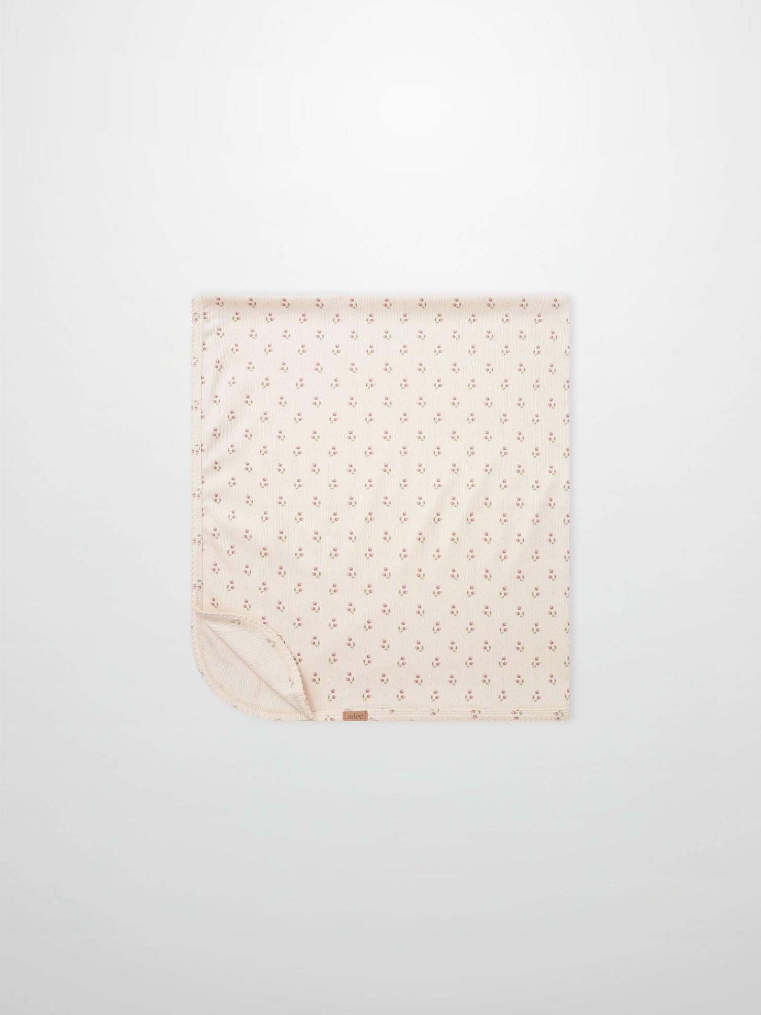 Tiny Tulip Blanket by Adee; pale pink girls swaddle blanket with a delicate tiny tulip print design.