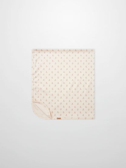 Tiny Tulip Blanket by Adee; pale pink girls swaddle blanket with a delicate tiny tulip print design.