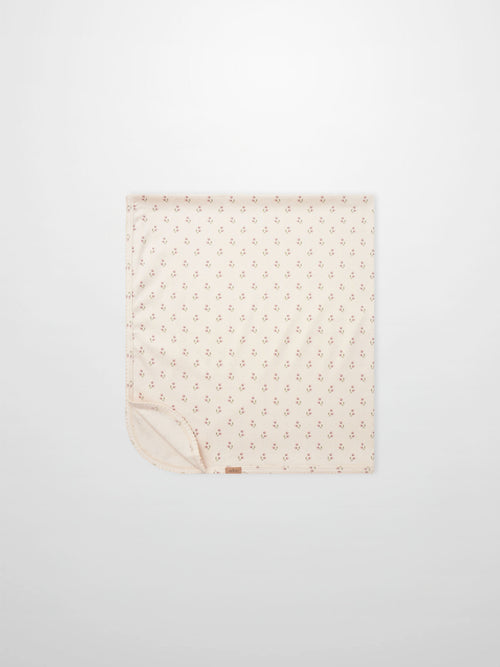 Tiny Tulip Blanket by Adee; pale pink girls swaddle blanket with a delicate tiny tulip print design.