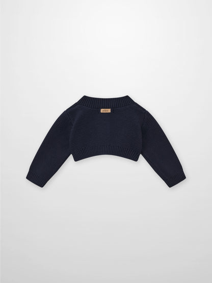 Cropped cardigan navy by Adee; unisex dressy knit with ribbed hem and cuffs.