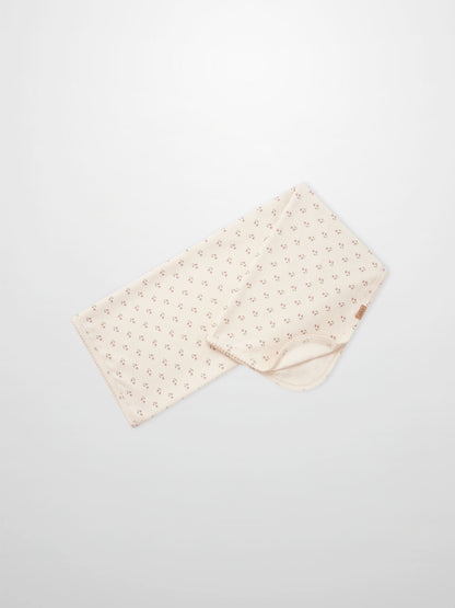 Tiny Tulip Blanket by Adee; cream girls swaddle blanket with tiny pink tulip floral pattern.