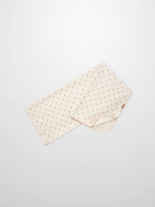 Tiny Tulip Blanket by Adee; cream girls swaddle blanket with tiny pink tulip floral pattern.
