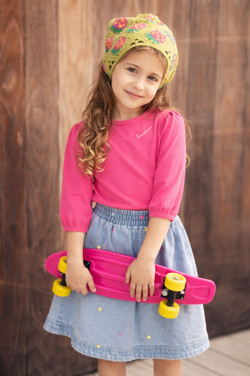 3/4 sleeve bubble T-shirt - pink, Adee brand, worn by a girl holding a pink skateboard with yellow wheels