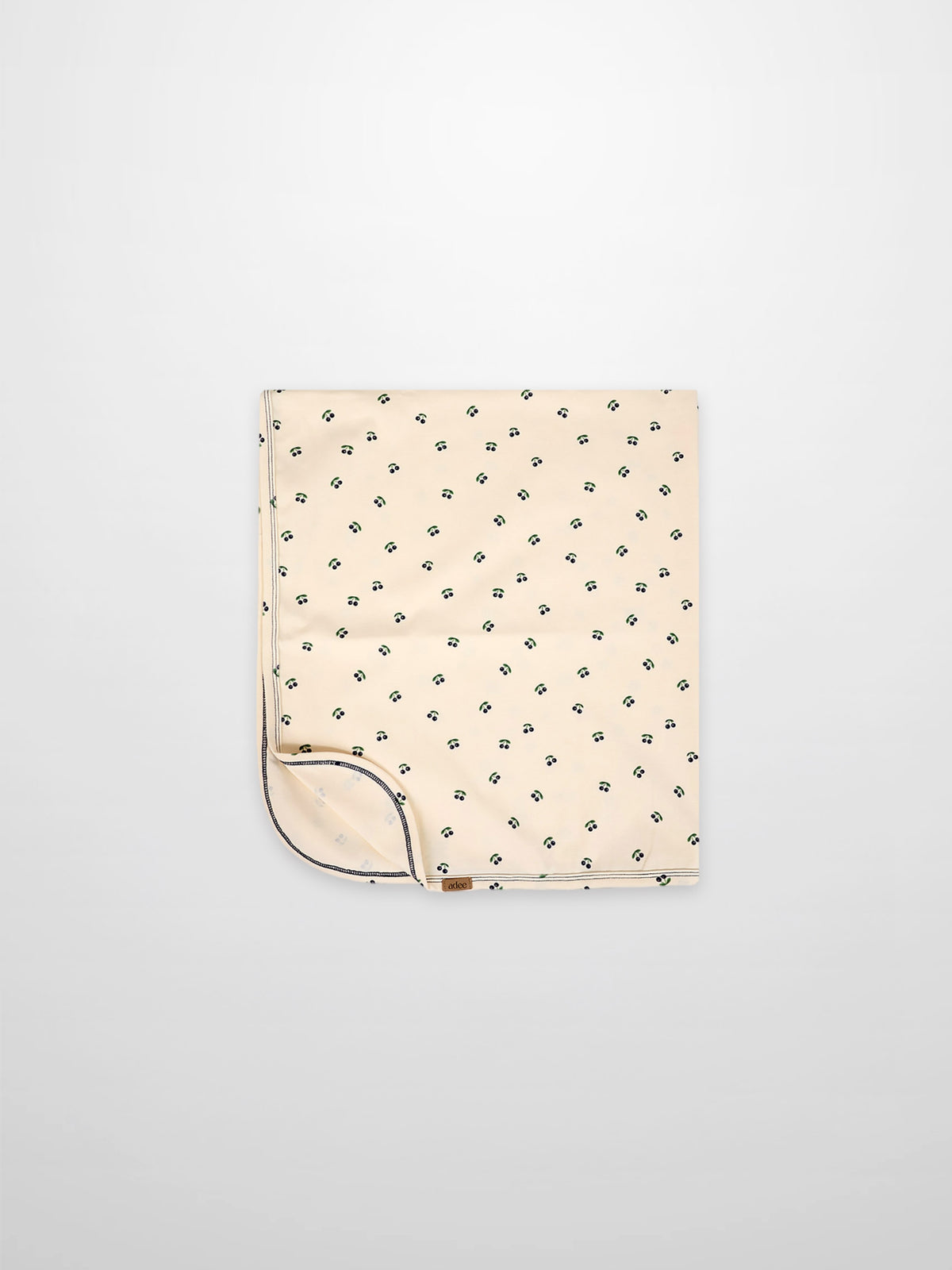 Blue Cherry Blanket, Adee boys swaddle blanket with scattered blue cherry print on cream fabric