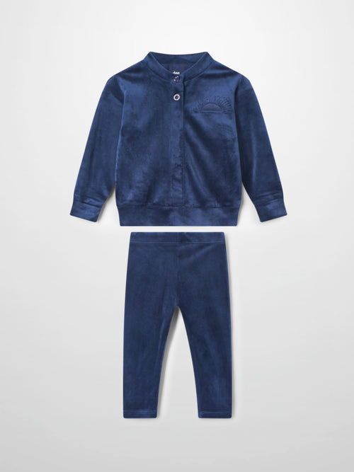 Plush navy velour bomber set for kids with two-button neck, embroidered crest, and matching pants.