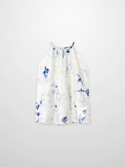 Blue Flower Jumper dress by Adee; white fabric with blue floral print and front pockets.