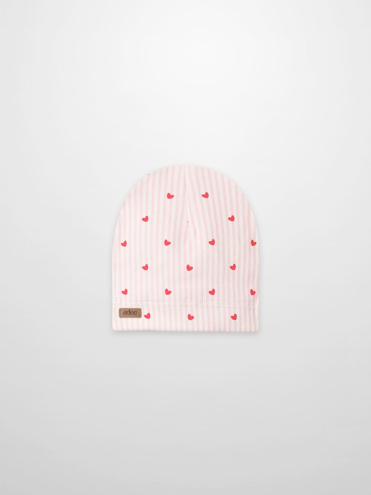 Pink Heart Hat for girls by Adee, pink striped beanie with red hearts, folded cuff and visible brown Adee tag.