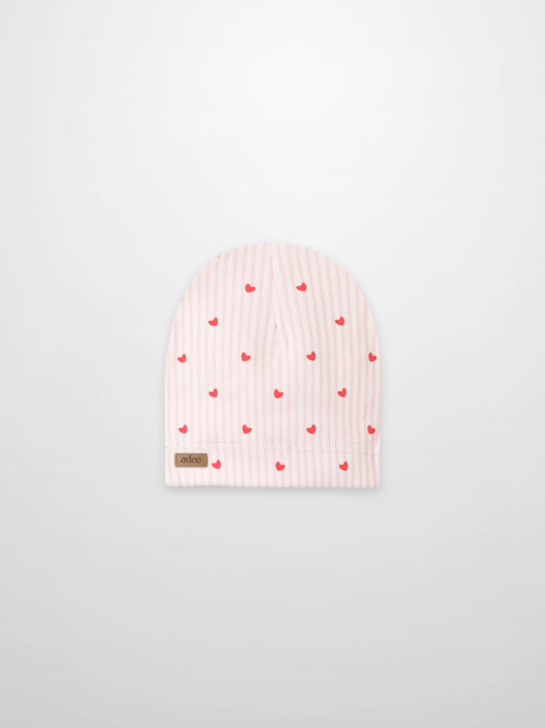 Pink Heart Hat for girls by Adee, pink striped beanie with red hearts, folded cuff and visible brown Adee tag.