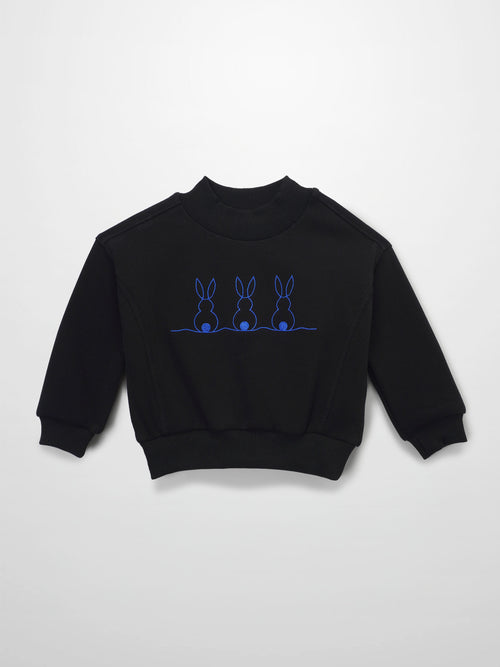 Black sweatshirt with blue embroidery of three bunnies on a horizontal line.