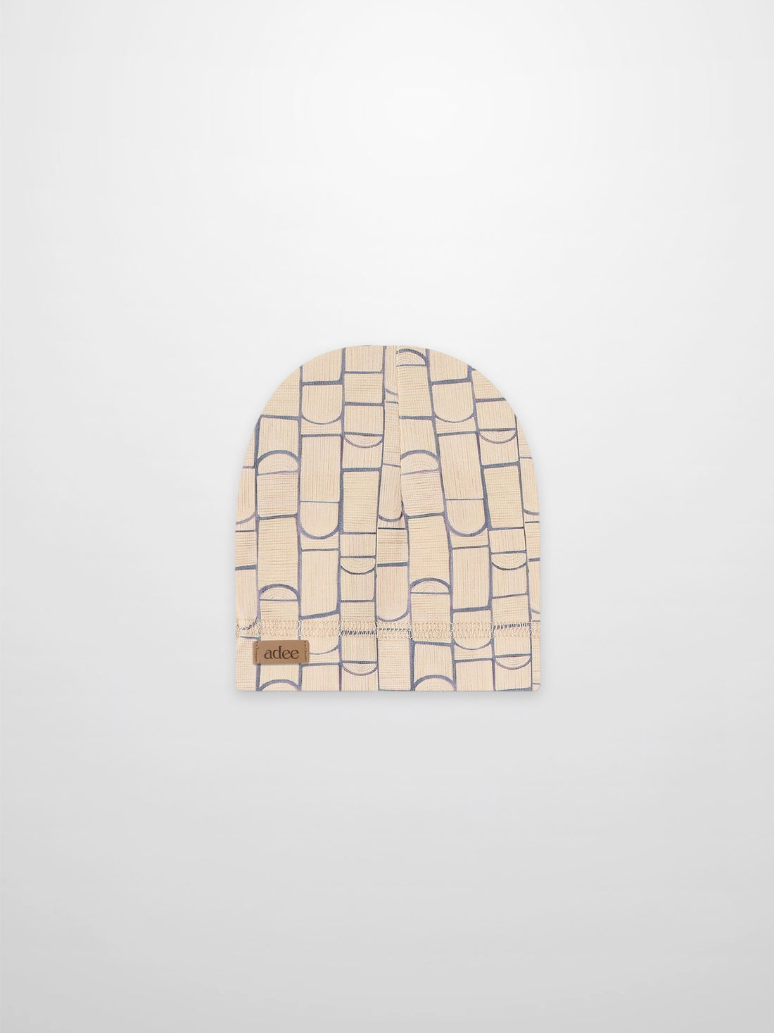 Geometric hat for boys in light blue on beige fabric with Adee brand patch