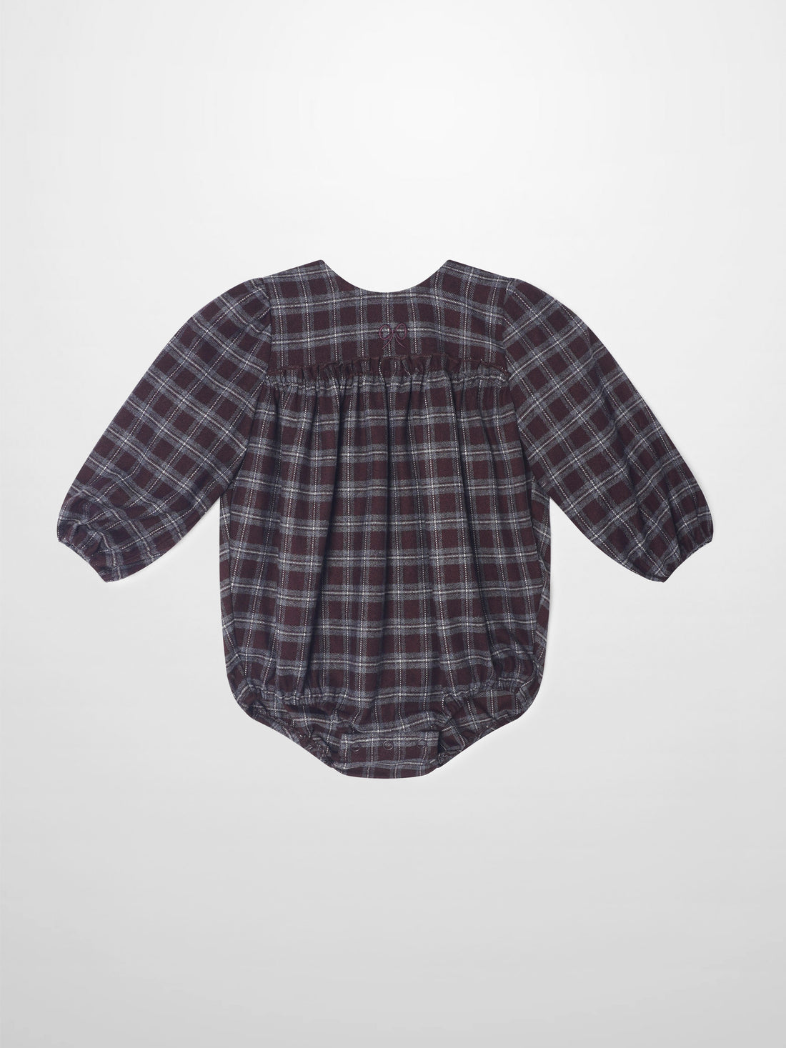 Plaid burgundy girls romper, dressy style with puff sleeves and gathered back waist.