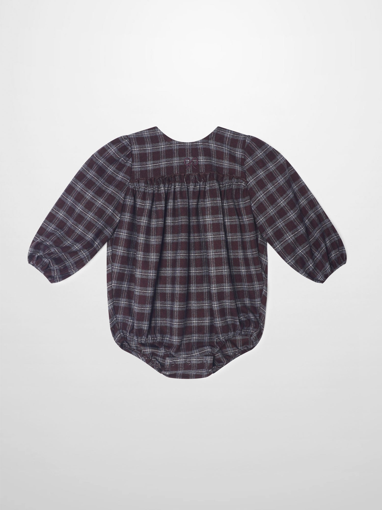 Plaid burgundy girls romper, dressy style with puff sleeves and gathered back waist.