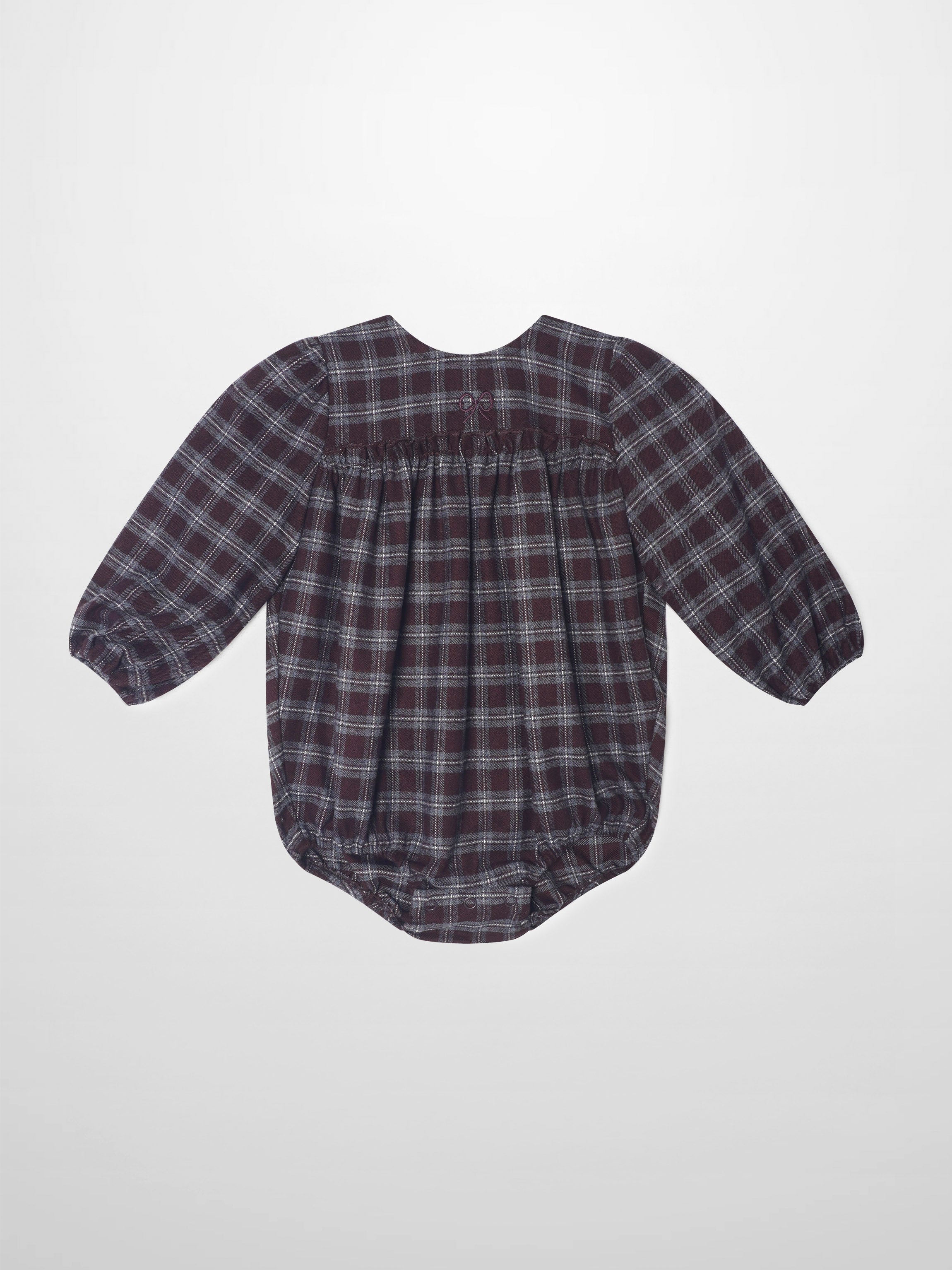 Plaid burgundy girls romper, dressy style with puff sleeves and gathered back waist.