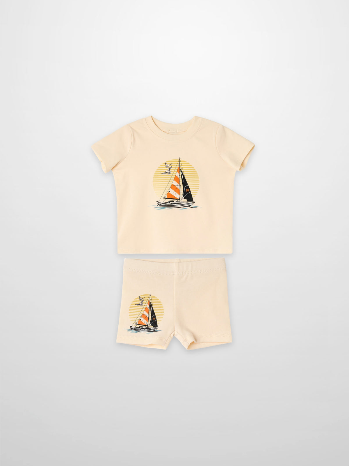 Golden Sail Shorts Set, peach two-piece outfit for little boys with a sailboat graphic.