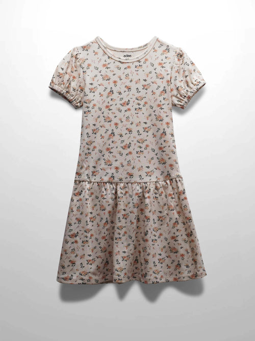 Petit Floral Dress - Short Bubble Sleeve in off-white with pink flowers, buds, leaves, and a flared drop waist.