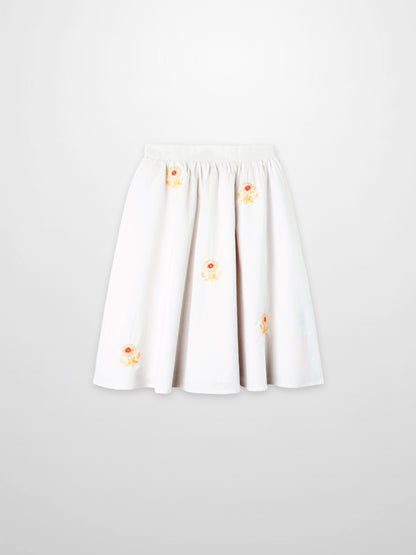 Embroidered Flower Skirt for girls, white dressy skirt with yellow-orange floral embroidery.