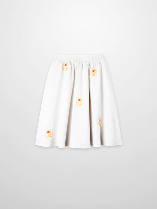 Embroidered Flower Skirt for girls, white dressy skirt with yellow-orange floral embroidery.